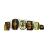 A small collection of papier mache snuff boxes