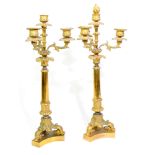 A pair of Charles X gilt bronze candlesticks