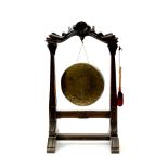 A Victorian carved oak free standing dinner gong