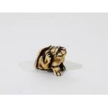 A Japanese carved ivory tiger netsuke signed Hogen Rantei