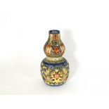A Chinese earthenware and enamelled gourd vase, 20th century