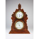 A Victorian gothic oak cased combined mantel timepiece and barometer