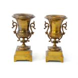 A pair of French spun brass, 2 handled campana urns c1900