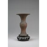 A small Chinese bronze baluster vase, Gu