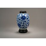 A Chinese Blue and White Vase and Wood Cover