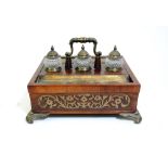 A Victorian rosewood and brass inlaid desk stand, dated 1860