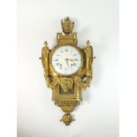 A Louis XVI ormolu striking cartel clock