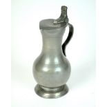 An 18th century pewter wine flagon