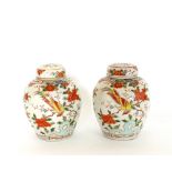 A pair of Chinese famille rose porcelain vases, and covers, 20th century