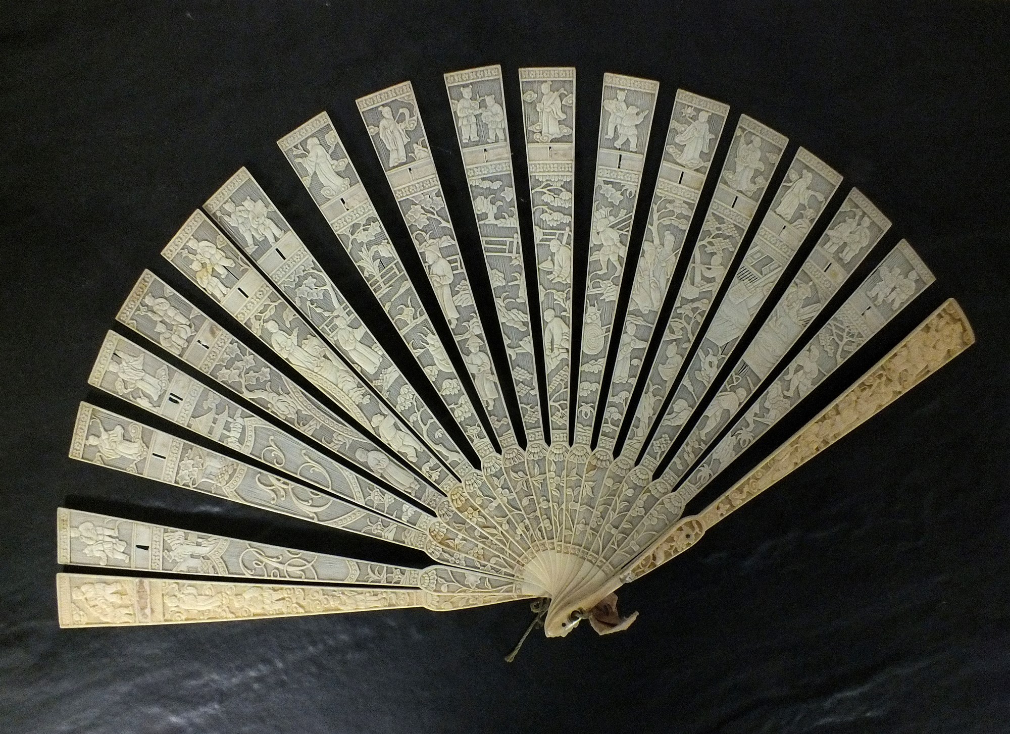 A Canton carved ivory brise fan
