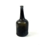 An 18th century English glass wine bottle