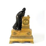 A French bronze ormolu mounted and Sienna marble mantel clock