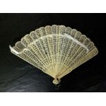 A Chinese carved bone brise fan, Qing dynasty