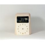 An Art Deco pink bakelite Vitascope automata clock