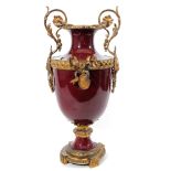 A French ormolu mounted two handled sang de boeuf vase