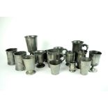 A collection of pewter drinking vessels