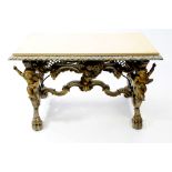 A carved parcel gilt console table