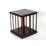 A mahogany and brass strung revolving book carrier
