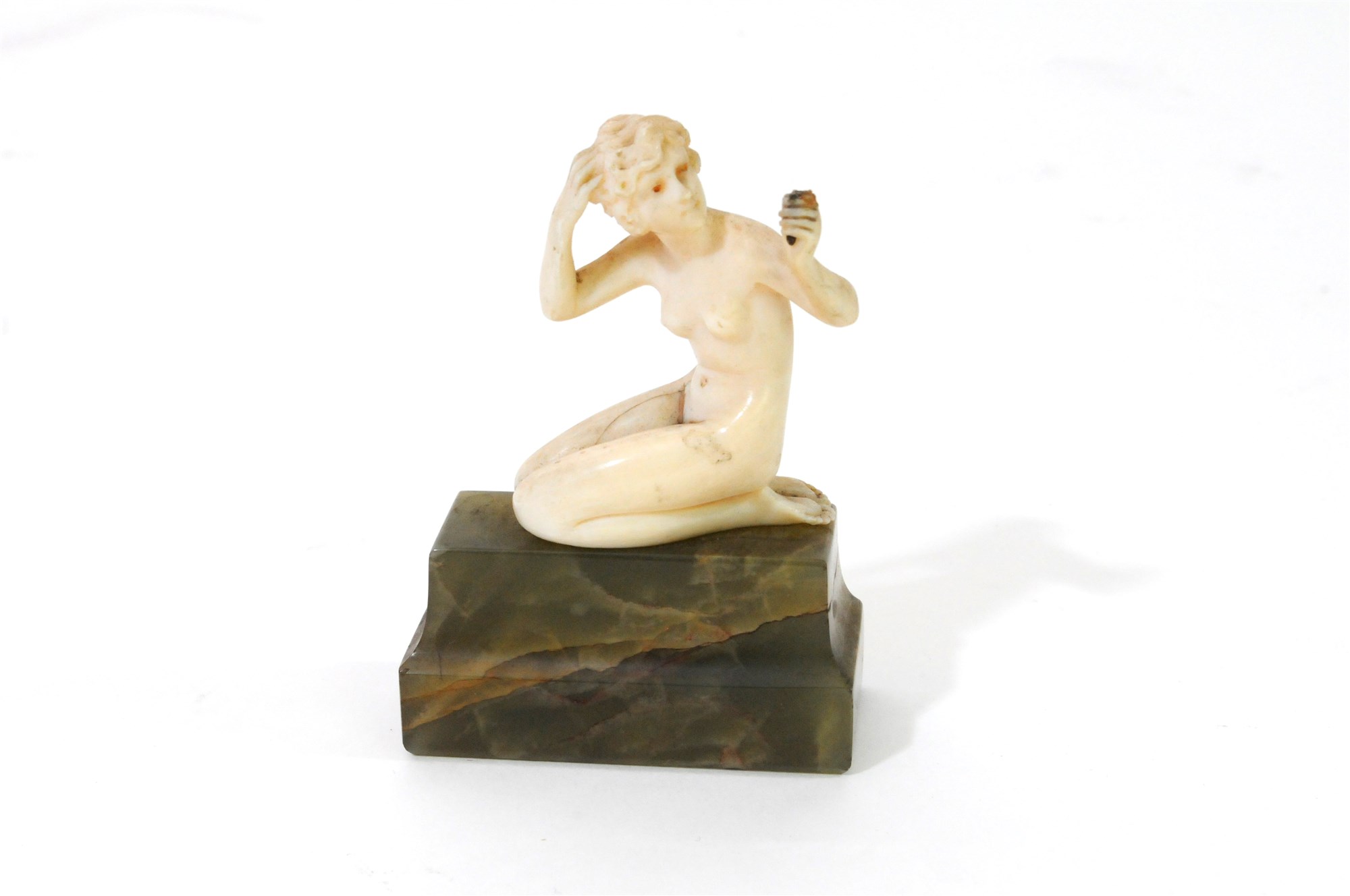 An Art Deco carved ivory figure 'Toilette' by Ferdinand Preiss