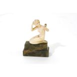 An Art Deco carved ivory figure 'Toilette' by Ferdinand Preiss