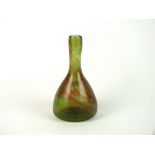 A Clutha glass bottle vase designed by Christopher Dresser