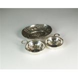 Two French silver wine tasters and a silver oval dish