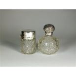 Two silver topped glass dressing table bottles