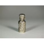 A miniature silver scent bottle