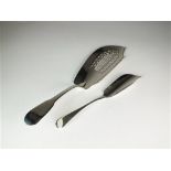 A silver fish slice and fish knife