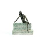 An Art Deco style cast metal figure on a stepped polished marble base