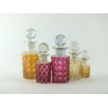 Five Baccarat glass perfume bottles and stoppers