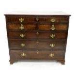 An early 19th century country oak chest of drawers