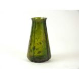 An early 20th century green glass vase in the manner of Loetz
