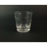 A commemorative glass tumbler