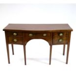 A 19th century serpentine mahogany sideboard