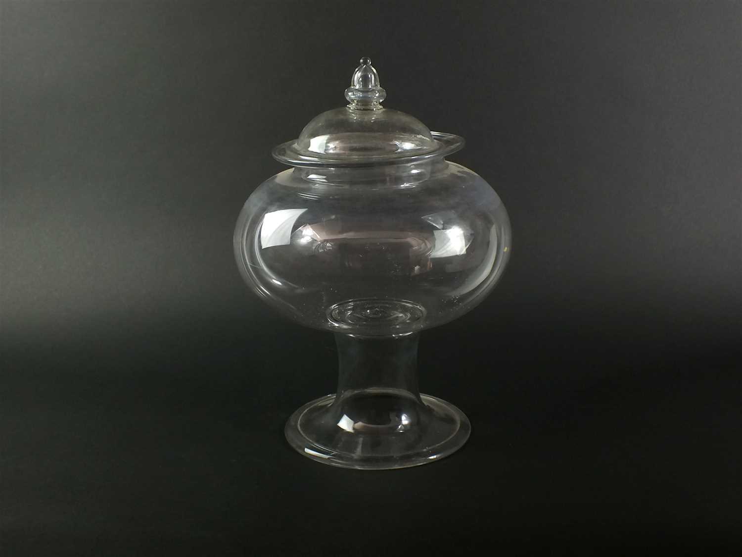 An early 19th century glass leech jar and cover