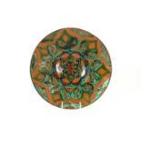 A Della Robbia Art Pottery charger by Liz Wilkins