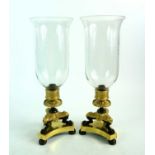 A pair of French Empire bronze, ormolu and gilt brass storm lamps / lanterns