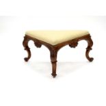 A 19th century carved mahogany framed upholstered stool