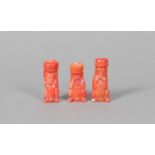 A trio of Chinese carved coral flasks in the form of monkeys