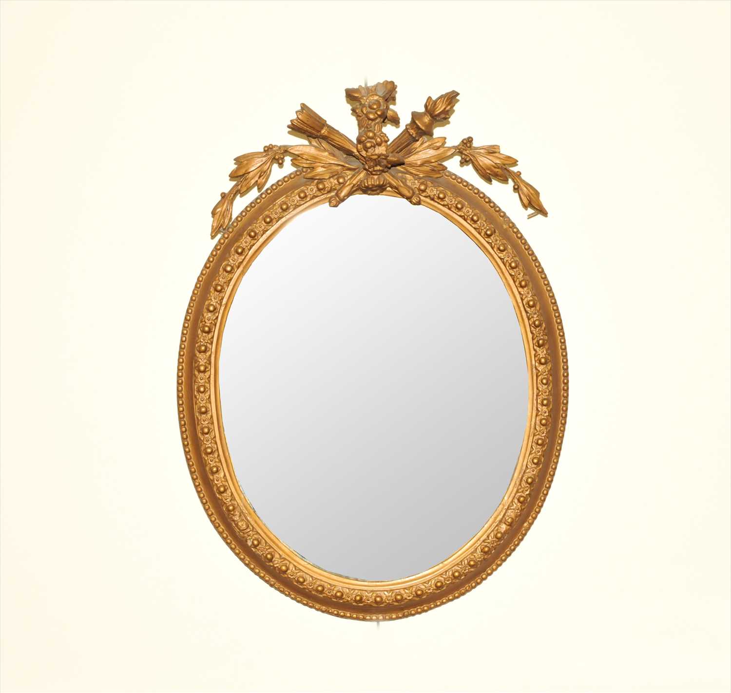 A late 19th century gilt plaster wall mirror