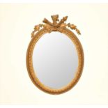 A late 19th century gilt plaster wall mirror