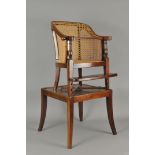 An Victorian child's mahogany framed bergere caned tub chair