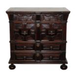 A Charles II and later oak and fruitwood chest of two short and three long drawers