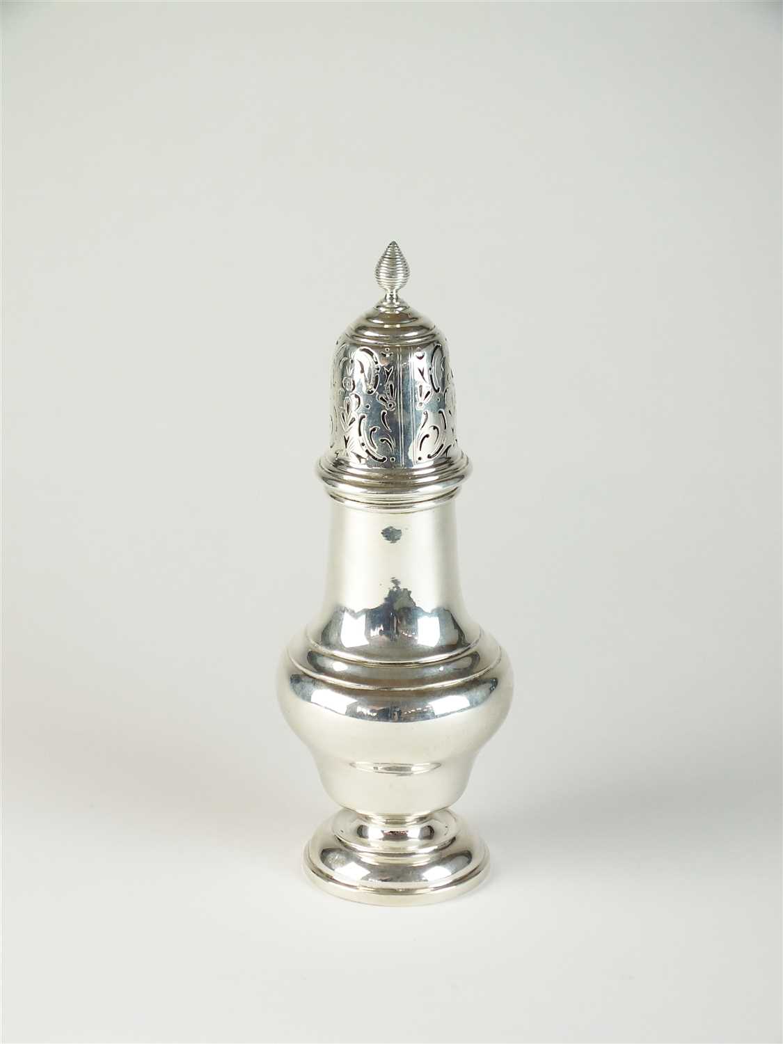 A silver sugar caster