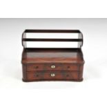 A small 19th century mahogany veneered stationary cabinet