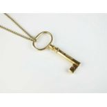 A 9ct gold key pendant