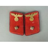 A matched set of German Third Reich Gau level collar tabs for an Arbeitsleiter, constructed of red