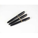 Three black Parker Duofold fountain pens