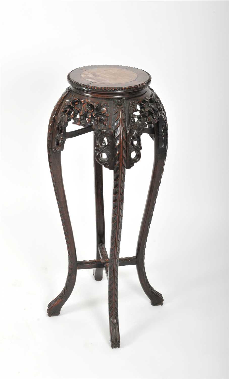 A late 19th / early 20th century Chinese carved hardwood jardinière stand